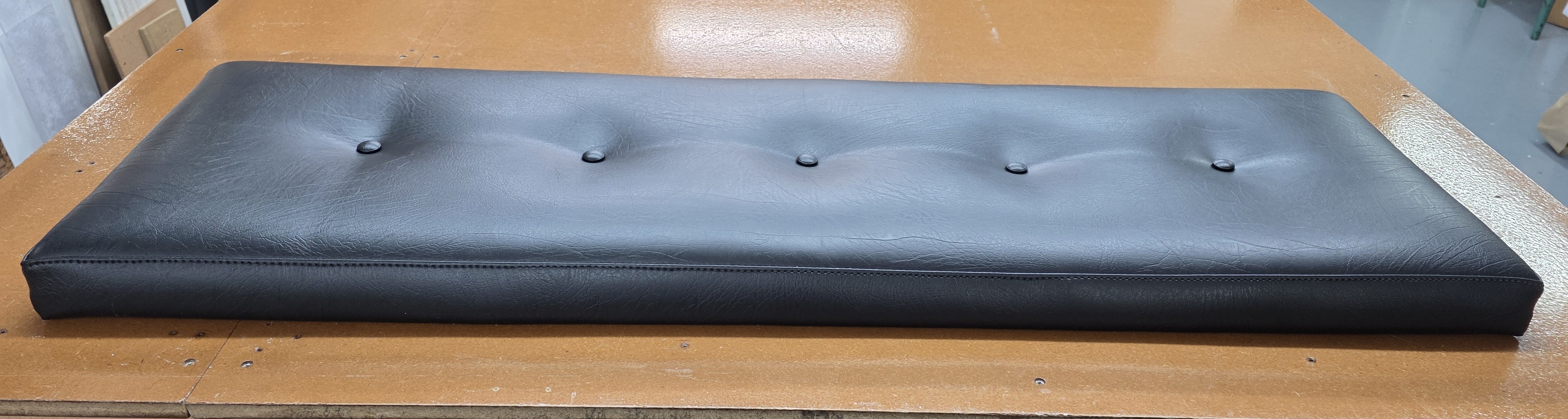 Finished button-tufted upholstered cushion