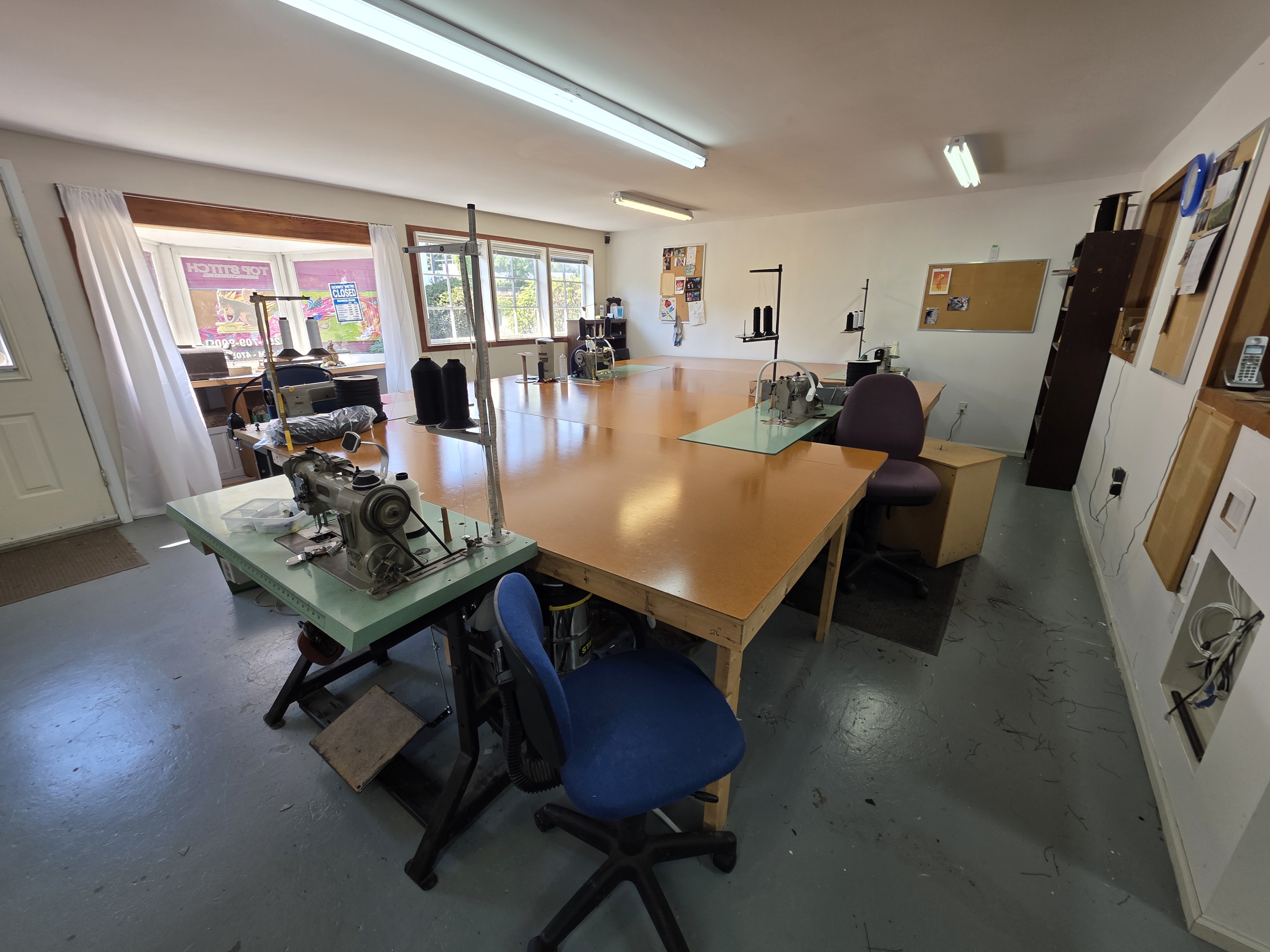 Industrial sewing machines inside the Top Stitch shop