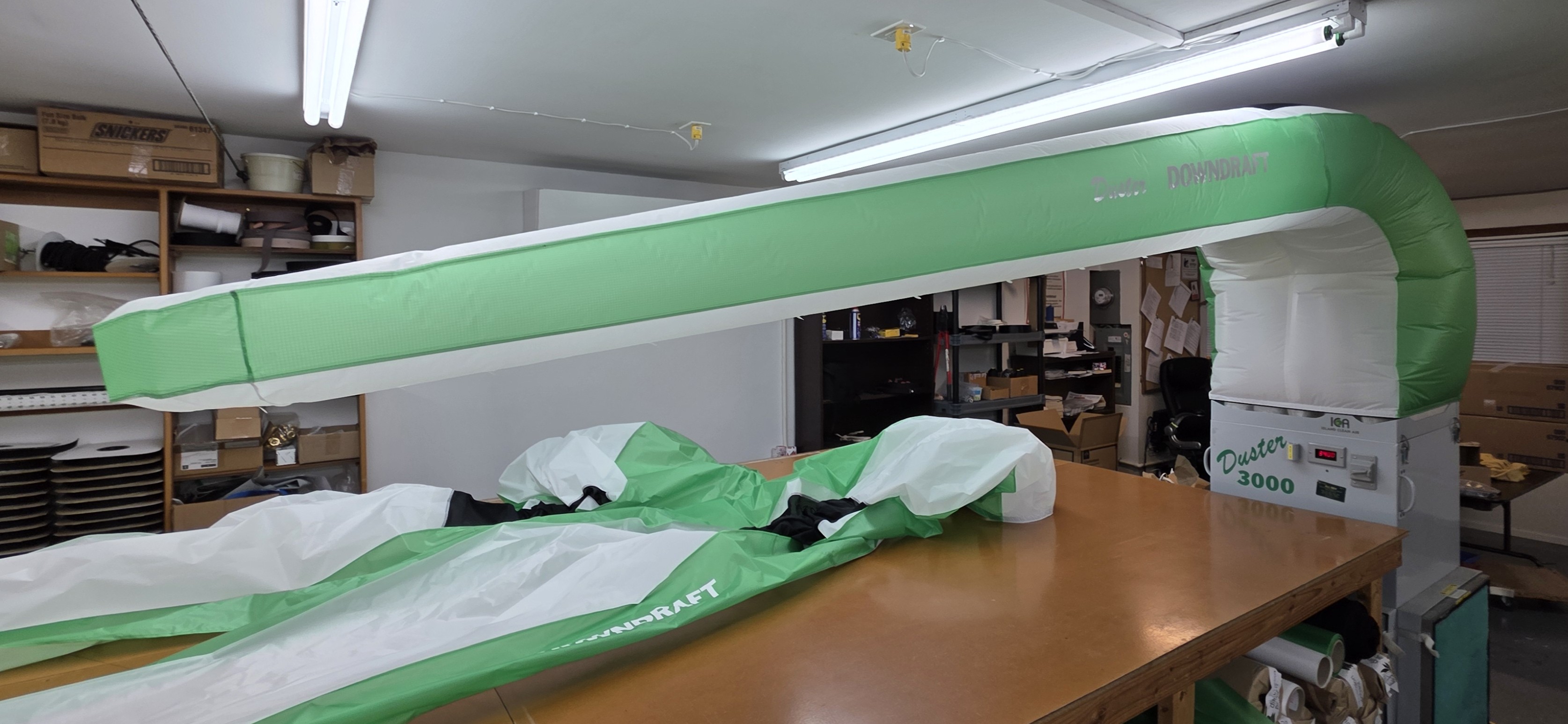 Large green and white custom inflatable assembly in production