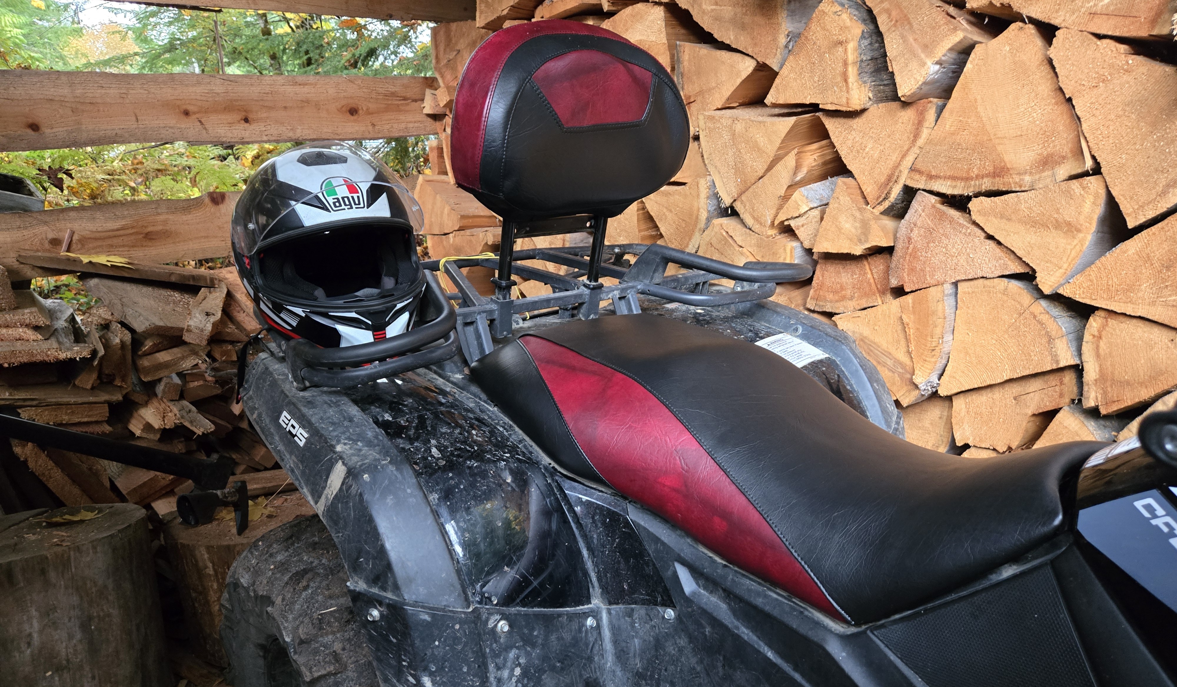 Custom black and burgundy ATV seats installed on the vehicle